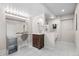 Contemporary bathroom boasts double vanity, illuminated mirrors, and a separate water closet at 18126 E Alamo Dr, Centennial, CO 80015