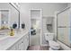 Bright bathroom with dual sinks, modern fixtures, and a shower-tub combo, all meticulously maintained at 18126 E Alamo Dr, Centennial, CO 80015