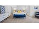 Bright bedroom with a king-sized bed, stylish bench, and modern nightstands with lamps at 18126 E Alamo Dr, Centennial, CO 80015