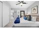 This bedroom boasts a large closet, neutral walls, and plush bedding, creating a peaceful retreat at 18126 E Alamo Dr, Centennial, CO 80015