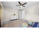 Airy room featuring a dresser with decor and ceiling fan, creating a comfortable, flexible space at 18126 E Alamo Dr, Centennial, CO 80015