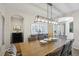 Spacious dining room features a wooden table, comfortable seating, and modern decor, ideal for Gathering gatherings at 18126 E Alamo Dr, Centennial, CO 80015