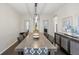 Formal dining room boasts modern light fixture, hardwood floors, and elegant design, perfect for entertaining at 18126 E Alamo Dr, Centennial, CO 80015