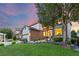 Charming home with manicured lawn, rock garden, and mature tree at 18126 E Alamo Dr, Centennial, CO 80015