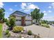 Well-maintained home with three-car garage, manicured landscaping, and a spacious driveway at 18126 E Alamo Dr, Centennial, CO 80015