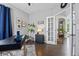 Bright home office featuring a stylish desk and decor, adjacent to arched doorway at 18126 E Alamo Dr, Centennial, CO 80015