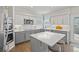 Bright, modern kitchen with stainless steel appliances, a center island, and sleek countertops, perfect for cooking at 18126 E Alamo Dr, Centennial, CO 80015