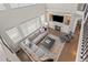 Open living room boasts a fireplace, large windows, and hardwood floors, creating a comfortable and bright space at 18126 E Alamo Dr, Centennial, CO 80015