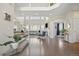 Spacious living room featuring a staircase, hardwood floors, and ample natural light at 18126 E Alamo Dr, Centennial, CO 80015