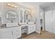 Beautiful bathroom with double vanities and sinks, updated lighting, and glass enclosed shower at 18126 E Alamo Dr, Centennial, CO 80015