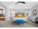 Spacious primary bedroom with ensuite bathroom, bright colors, large windows, and ceiling fan at 18126 E Alamo Dr, Centennial, CO 80015