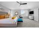 Comfortable main bedroom featuring soft carpet, modern furniture and a ceiling fan at 18126 E Alamo Dr, Centennial, CO 80015