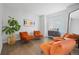 Stylish sitting room featuring hardwood floors, bright colors, comfortable chairs, and natural light at 18126 E Alamo Dr, Centennial, CO 80015