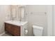 This bathroom features a double sink with wood cabinets and a chrome fixtures at 4762 S Clay Ct, Englewood, CO 80110