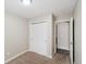 Neutral bedroom with carpet flooring, a closet and an adjoining room at 4762 S Clay Ct, Englewood, CO 80110