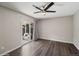 Inviting bedroom with sliding glass doors to patio, hardwood floors and neutral tones at 4762 S Clay Ct, Englewood, CO 80110
