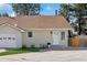 Charming single-story home featuring a well-manicured front lawn and attached garage at 4762 S Clay Ct, Englewood, CO 80110