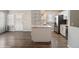 Modern kitchen featuring stainless steel appliances, granite countertops, and ample storage space at 4762 S Clay Ct, Englewood, CO 80110
