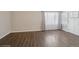 Bright living room with hardwood floors, large windows, and neutral walls at 4762 S Clay Ct, Englewood, CO 80110