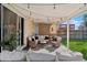 Relaxing covered patio with cushioned seating and string lights perfect for outdoor enjoyment at 4762 S Clay Ct, Englewood, CO 80110