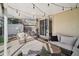 Cozy covered patio with comfortable seating and stylish decor, perfect for outdoor relaxation at 4762 S Clay Ct, Englewood, CO 80110