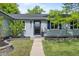 Charming home featuring a welcoming front yard with a walkway and decorative landscaping at 886 S Jersey St, Denver, CO 80224