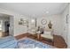 Open living space with hardwood floors, stylish seating, and neutral wall colors at 886 S Jersey St, Denver, CO 80224