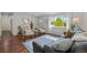 Bright living room featuring hardwood floors, a large window, and stylish decor at 886 S Jersey St, Denver, CO 80224