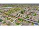 This aerial shot showcases the condo complex, landscaping, nearby roads, and ample parking available to residents at 7835 Barbara Ann Dr # C, Arvada, CO 80004