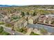 Aerial view of a complex with mature trees and well-maintained landscaping with ample parking for residents and guests at 7835 Barbara Ann Dr # C, Arvada, CO 80004