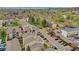 This aerial shot showcases the complex with mature landscaping, walking paths, and assigned parking available to residents at 7835 Barbara Ann Dr # C, Arvada, CO 80004