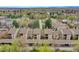 Aerial view of a well-maintained condo community with mature trees and convenient parking at 7835 Barbara Ann Dr # C, Arvada, CO 80004