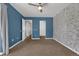 Spacious bedroom featuring carpeted floor, ceiling fan, and neutral wall paint at 7835 Barbara Ann Dr # C, Arvada, CO 80004