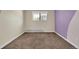Clean bedroom with neutral carpeting, painted accent wall, and a window letting in natural light at 7835 Barbara Ann Dr # C, Arvada, CO 80004