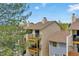 Exterior view of multilevel condo buildings with balconies and mature trees at 7835 Barbara Ann Dr # C, Arvada, CO 80004