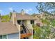 Exterior view of a condo building with private balconies and stairwell entry at 7835 Barbara Ann Dr # C, Arvada, CO 80004