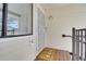 Inviting entryway with secure door, welcome mat, and natural light from the window with blinds at 7835 Barbara Ann Dr # C, Arvada, CO 80004