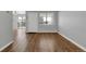 Bright living room with modern laminate flooring and abundant natural light at 7835 Barbara Ann Dr # C, Arvada, CO 80004