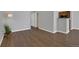 Open-concept living area featuring stylish laminate flooring and neutral paint palette at 7835 Barbara Ann Dr # C, Arvada, CO 80004