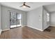 Living room featuring wood laminate flooring and sliding doors to a patio at 7835 Barbara Ann Dr # C, Arvada, CO 80004