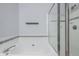 Bathroom features a soaking tub and separate glass-enclosed shower at 8300 Fairmount Dr # J105, Denver, CO 80247