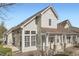Beautiful exterior view showcases light siding, complemented by white trim and many windows for natural light at 8300 Fairmount Dr # J105, Denver, CO 80247