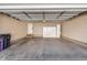 Spacious garage with epoxy floors, storage cabinets, and ample room for vehicles and projects at 8300 Fairmount Dr # J105, Denver, CO 80247