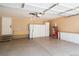 Spacious garage with epoxy floors, storage cabinets, and ample room for vehicles and projects at 8300 Fairmount Dr # J105, Denver, CO 80247