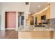 Kitchen featuring granite countertops, stainless steel appliances, and an open layout with a breakfast bar at 8300 Fairmount Dr # J105, Denver, CO 80247