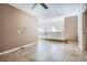 Open loft area with tile flooring and a view of the house's architectural design at 8300 Fairmount Dr # J105, Denver, CO 80247