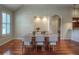 Bright dining area showcasing hardwood floors, lighting and open floor plan at 8594 W Quarto Ave, Littleton, CO 80128