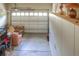 Finished garage with storage, seating area, and insulated door at 8594 W Quarto Ave, Littleton, CO 80128