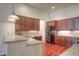 Well-designed kitchen with granite countertops, stainless steel appliances, and plenty of cabinet space at 8594 W Quarto Ave, Littleton, CO 80128