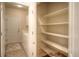 Walk-in pantry with white shelving, offering ample space for organized storage and easy access at 8594 W Quarto Ave, Littleton, CO 80128